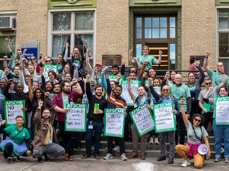 Photo of OHSU workers with rally signs